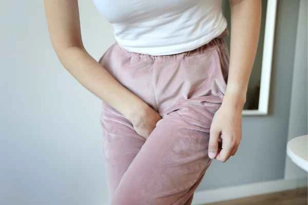 woman running for the toilet because of urinary incontinence Hounslow Heath